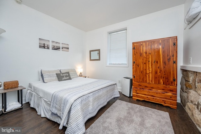 bedroom featuring dark wood-type flooring