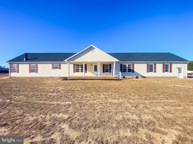 single story home with a porch and a front yard