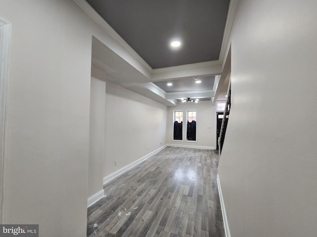 corridor featuring hardwood / wood-style floors, ornamental molding, and beamed ceiling