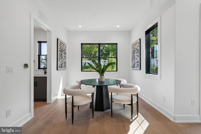 dining space featuring wood-type flooring