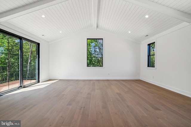 unfurnished living room featuring vaulted ceiling with beams, plenty of natural light, wood ceiling, and hardwood / wood-style flooring