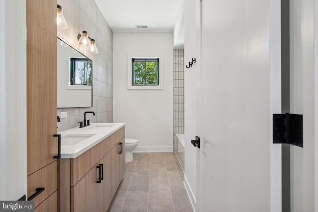 full bathroom featuring tasteful backsplash, shower / bathtub combination, vanity, tile patterned flooring, and toilet