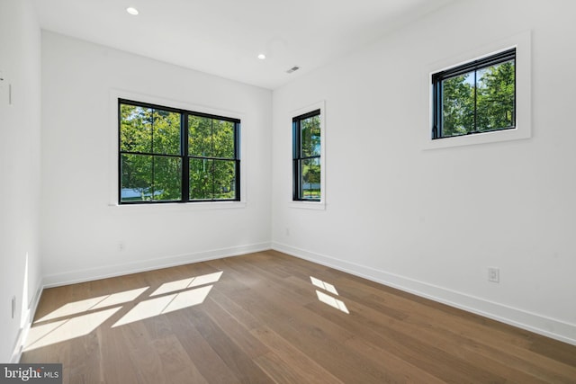 spare room with hardwood / wood-style flooring