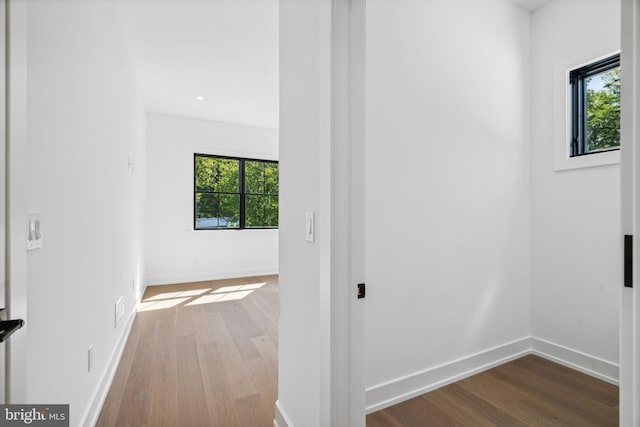 hallway with light hardwood / wood-style flooring