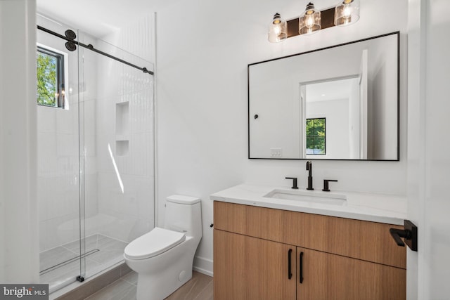 bathroom with vanity, toilet, and walk in shower