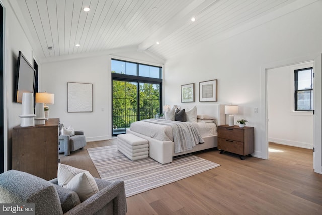 bedroom featuring vaulted ceiling with beams, light hardwood / wood-style floors, wood ceiling, and access to outside