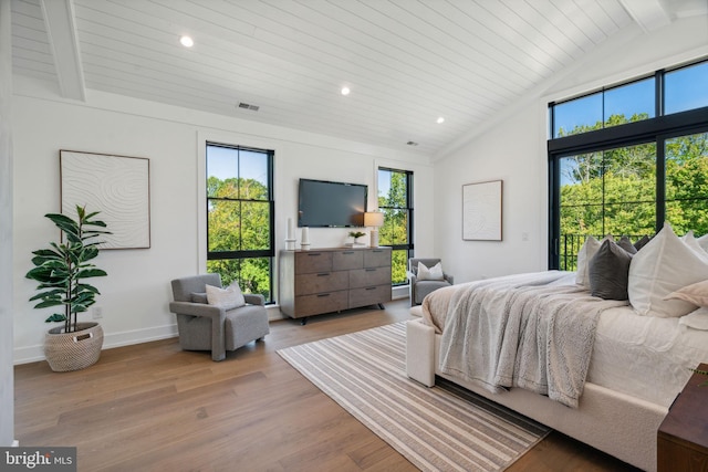 bedroom featuring vaulted ceiling with beams, wooden ceiling, and light hardwood / wood-style flooring