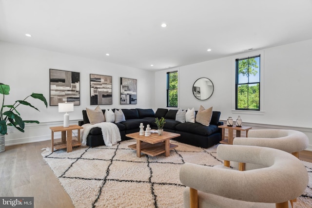 living room with light hardwood / wood-style flooring