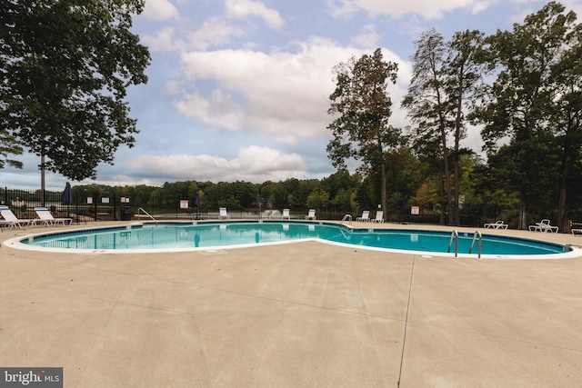 view of pool featuring a patio