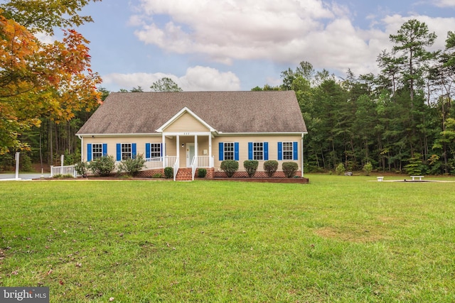 view of front of house with covered porch and a front lawn