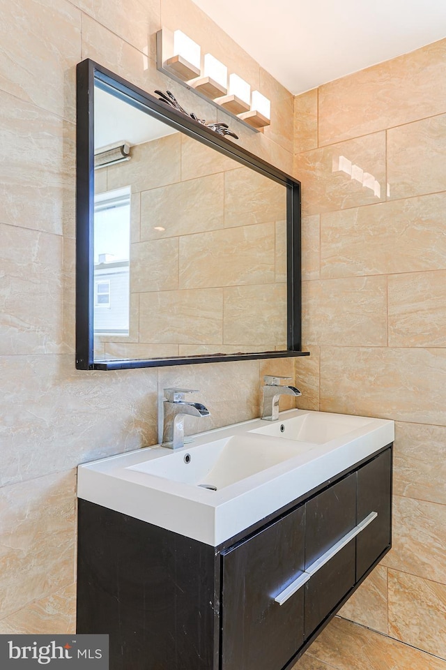 bathroom with tile walls, backsplash, and vanity