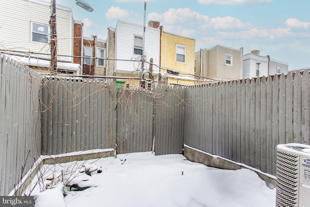 view of yard layered in snow