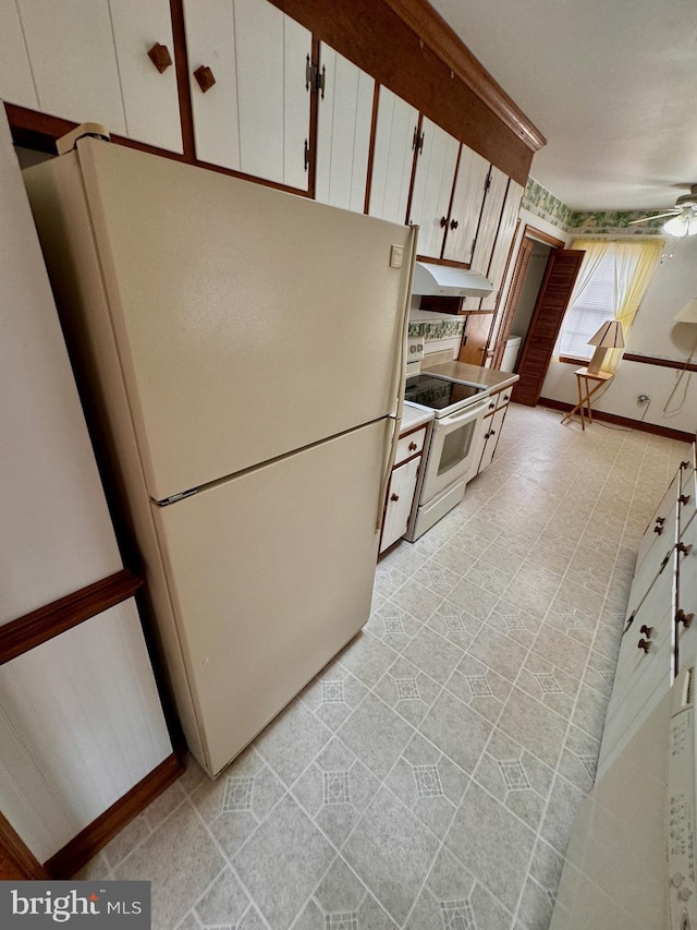 kitchen with white cabinetry, ceiling fan, and white appliances