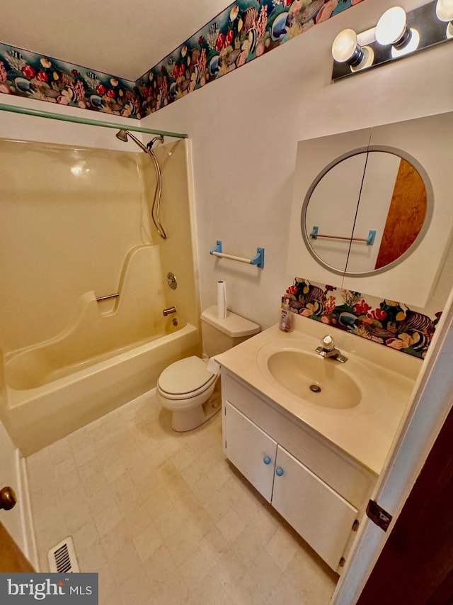 full bathroom featuring vanity, toilet, and shower / bath combination