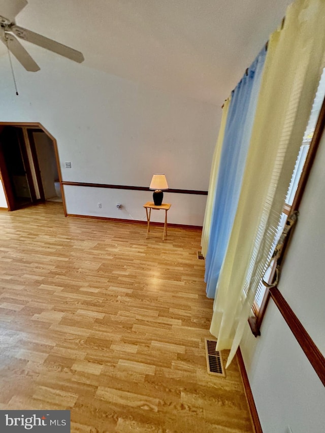 interior space with ceiling fan and light hardwood / wood-style floors