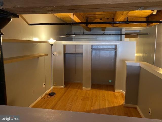 basement featuring light hardwood / wood-style flooring