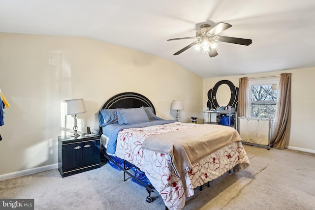 carpeted bedroom with ceiling fan and lofted ceiling