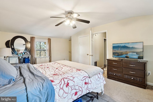 carpeted bedroom featuring vaulted ceiling and ceiling fan