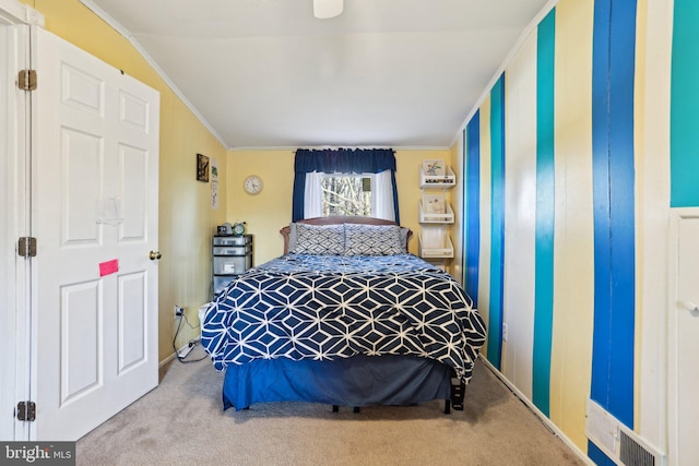 carpeted bedroom with ornamental molding