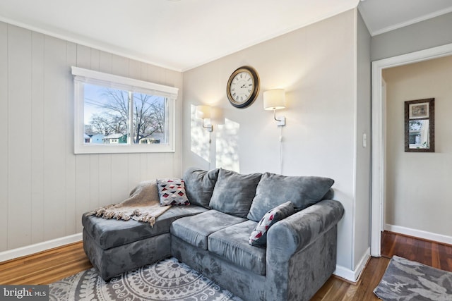 living room with crown molding and hardwood / wood-style flooring