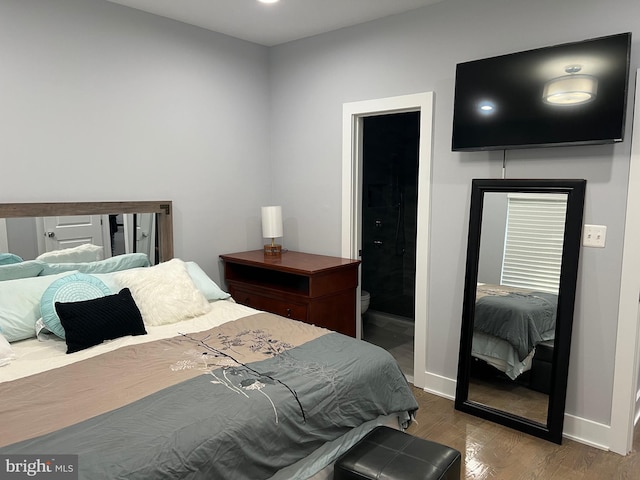 bedroom featuring hardwood / wood-style floors