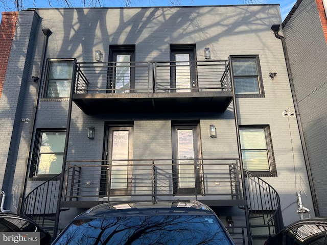 back of house with a balcony