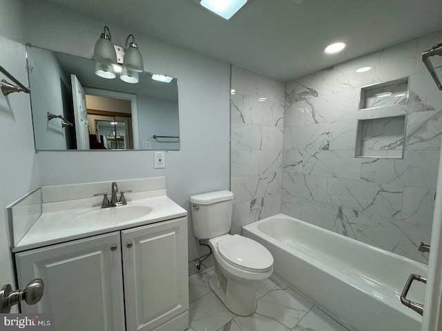 full bathroom featuring vanity, tiled shower / bath combo, and toilet