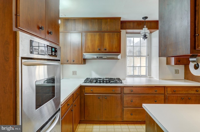 kitchen featuring decorative light fixtures and appliances with stainless steel finishes