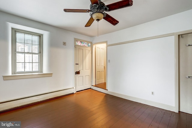 empty room featuring a baseboard radiator, dark hardwood / wood-style floors, and ceiling fan