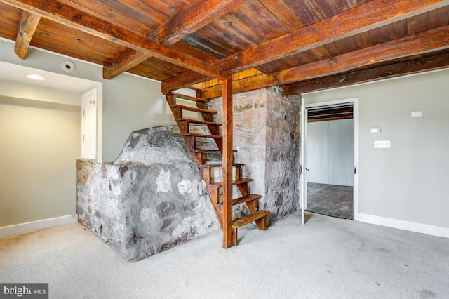 basement featuring carpet and wood ceiling