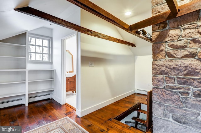 interior space with lofted ceiling, dark wood-type flooring, and baseboard heating