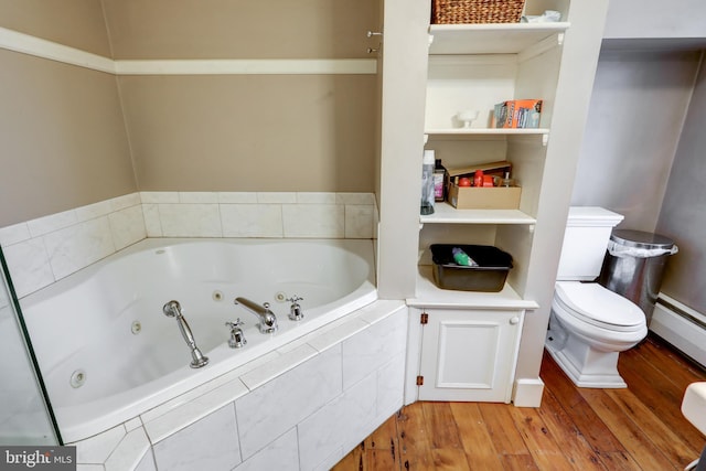 bathroom featuring hardwood / wood-style flooring, a relaxing tiled tub, toilet, and baseboard heating