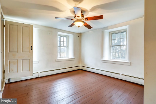 unfurnished room with baseboard heating, light hardwood / wood-style flooring, and ceiling fan