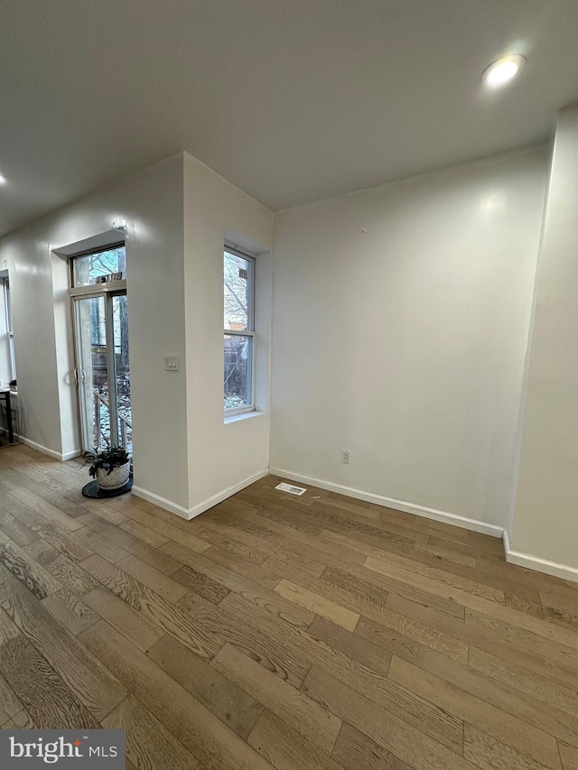 empty room featuring wood-type flooring