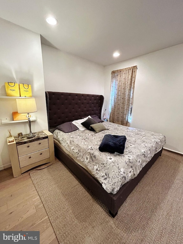 bedroom with light hardwood / wood-style floors