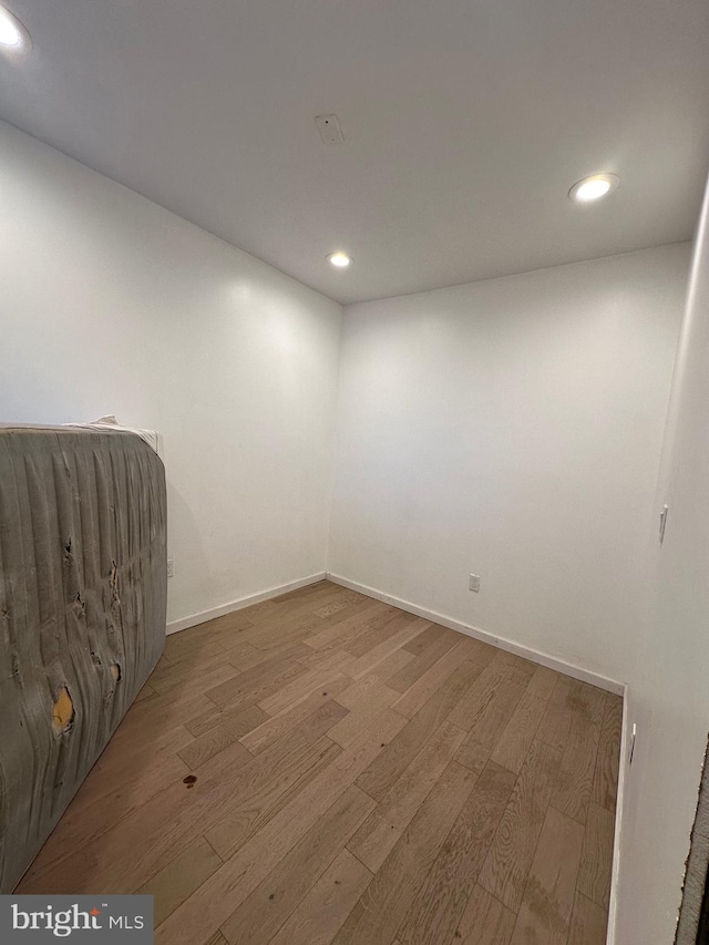 spare room featuring hardwood / wood-style floors