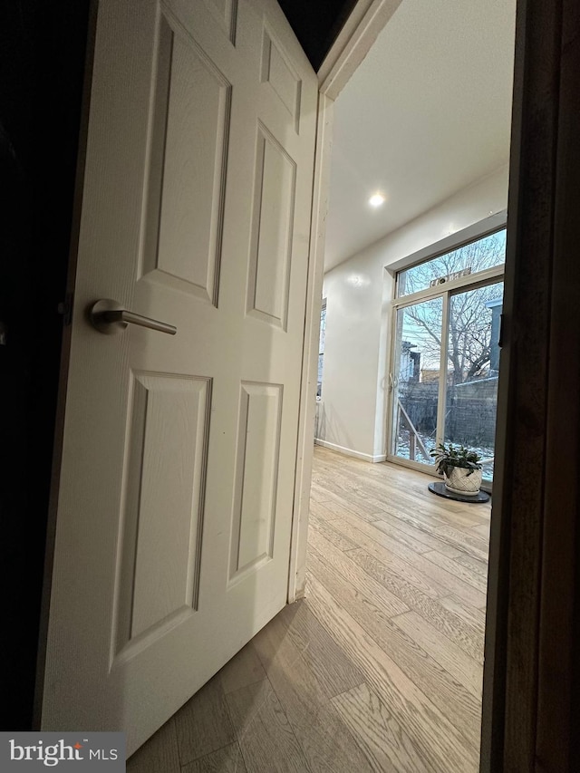 corridor featuring hardwood / wood-style floors