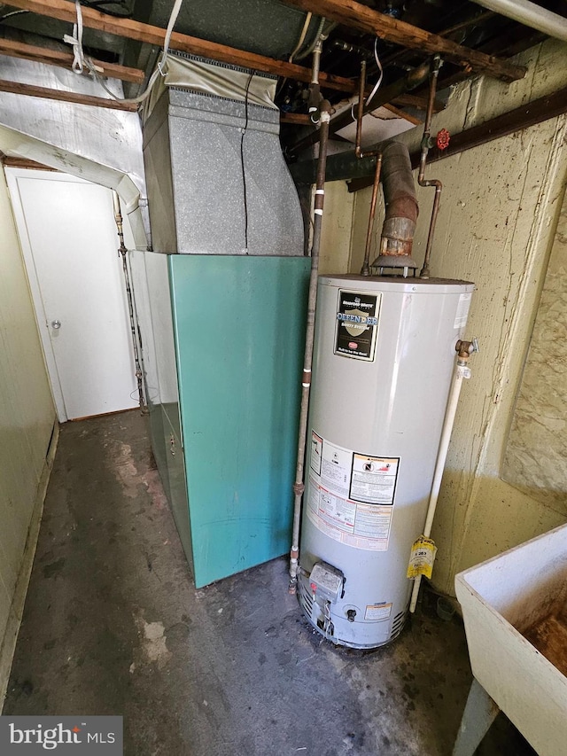 utilities with sink, heating unit, and water heater