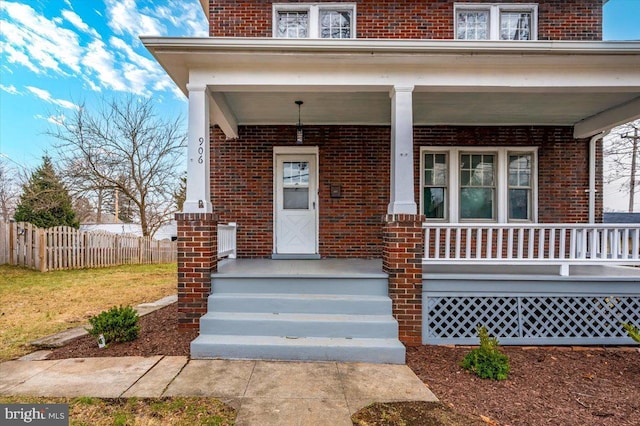 property entrance featuring a porch