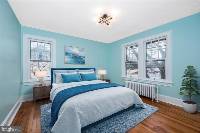 bedroom featuring dark hardwood / wood-style floors and radiator heating unit