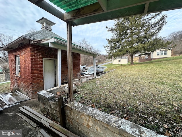 view of side of property with a lawn