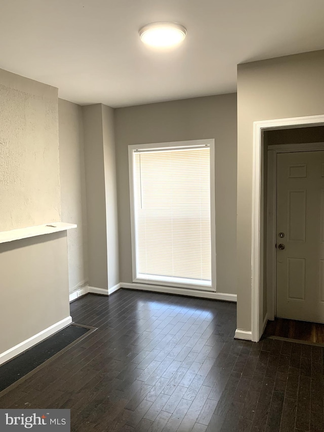 interior space with dark hardwood / wood-style flooring