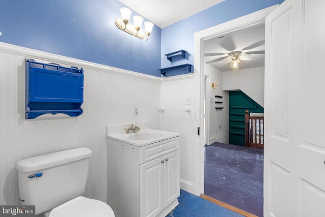 bathroom featuring ceiling fan, vanity, and toilet