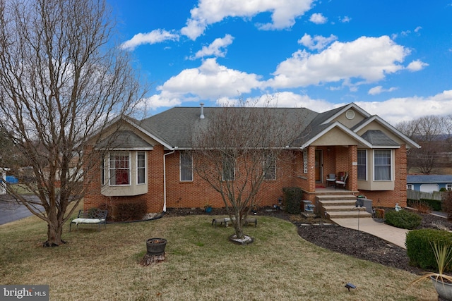 view of front of house with covered porch and a front yard