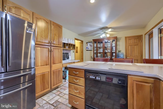 kitchen featuring dishwasher, stainless steel fridge, and ceiling fan