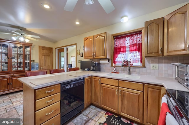 kitchen with sink, black dishwasher, kitchen peninsula, stove, and decorative backsplash