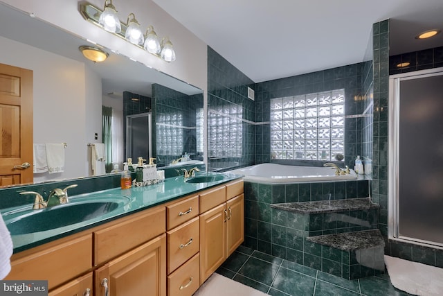 bathroom with plus walk in shower, vanity, and tile patterned floors