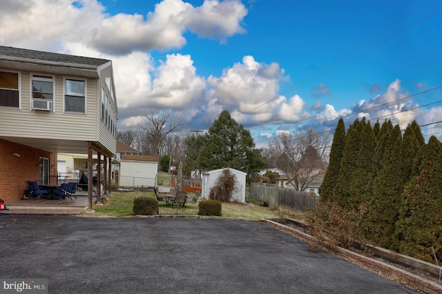 view of yard featuring cooling unit and a patio area