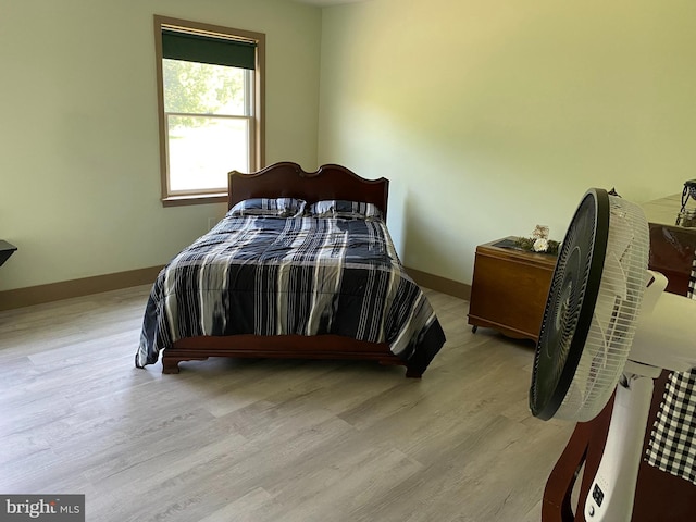 bedroom with light hardwood / wood-style floors