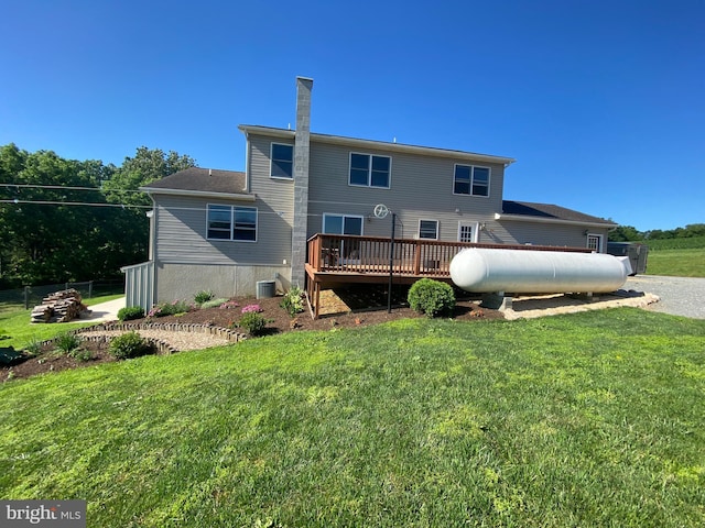 back of house with a yard, cooling unit, and a wooden deck